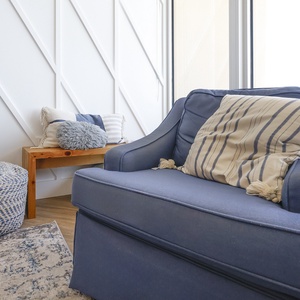 Gather in this welcoming living space and enjoy stunning beach views from the balcony