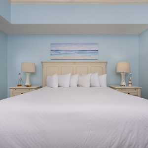 Unwind after a day at the beach in this elegant king master suite surrounded by stylish coastal accents