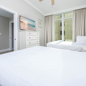 Experience restful nights in this queen guest room, with natural light streaming through the windows