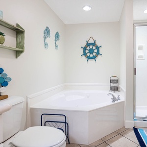 Indulge in relaxation in the master bath with a refreshing walk-in shower and soothing jetted tub