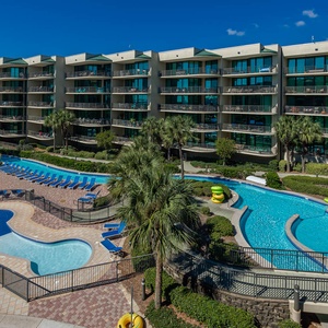 Discover the pool area with a refreshing lazy river and thrilling waterslide, just steps from the bay