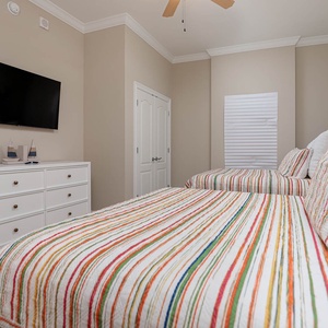 Unwind in this queen guest suite and stream your favorite shows or enjoy a good movie after a beach day