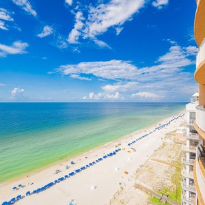 Enjoy breathtaking views of the turquoise waters and inviting beach from your balcony