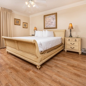 Retreat to the spacious master bedroom featuring a king bed, elegant decor, and beachfront balcony access