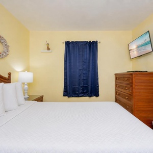 Sink into softness on the plush bedding, surrounded by charming coastal decor in your welcoming bedroom