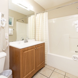 Additional full bath with a tub shower combo for comfort, convenience, and a refreshing stay