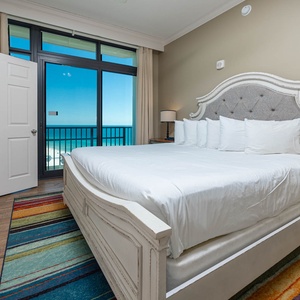 Rest comfortably in this king guest suite, enjoying the coastal views from balcony windows that invite relaxation