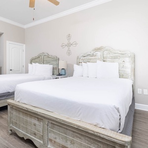 Relax on one of the cozy queen beds in this guest suite and enjoy a peaceful slumber