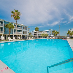 Make a splash on your next beach retreat in this inviting outdoor pool at Sea Oats in Gulf Shores