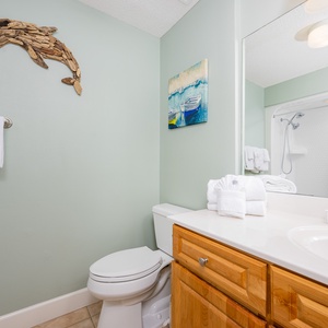 Freshen up in this guest bath in the relaxing shower or soothing tub before an exciting day