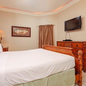 Relax on the cozy king bed in this guest suite and stream your favorite shows after a beach day