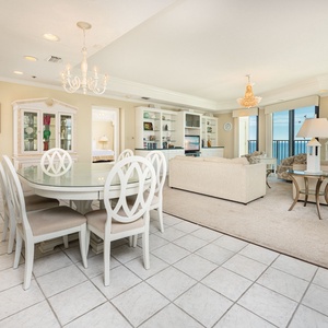 Enjoy meals at the elegant dining table, surrounded by inviting decor and spacious living area
