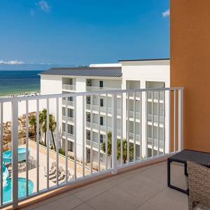 Soak up gulf views on the balcony while watching the pool slide and beach below