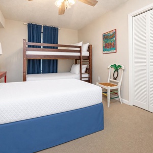 The guest suite offers a twin bed and twin bunk beds for restful nights after a day by the shore
