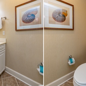 Additional half bath featuring a spacious vanity, elegant decor, and plush towels for your comfort