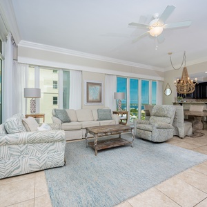Relax in the airy living space with comfortable seating, stunning beach views, and a stylish design