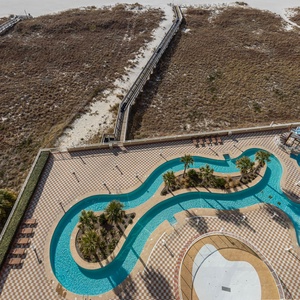 Outdoor pool area with gradual entry, a refreshing lazy river, fun waterslide, indoor hot tubs, and indoor pool