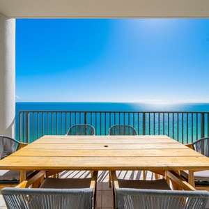 Savor the refreshing coastal views while lounging at your charming outdoor dining table, perfect for family moments
