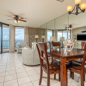 Relax in the inviting living area with a view, featuring comfortable seating and a dining table for shared meals