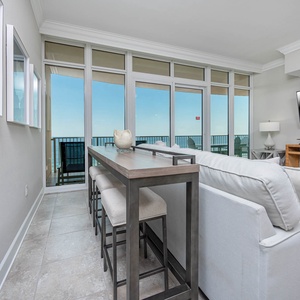 Relish the warmth of the sun as you connect with loved ones around the stylish bar seating with a stunning view