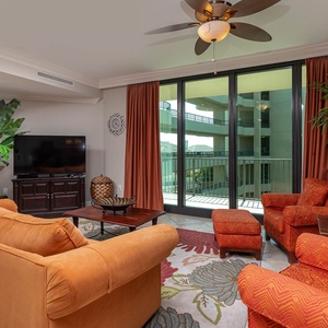 Relax in the spacious living room, surrounded by soft textures and vibrant decor, featuring a queen sofa sleeper