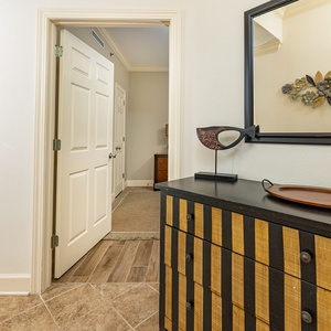 Step into this welcoming entryway featuring stylish decor, a decorative fish sculpture