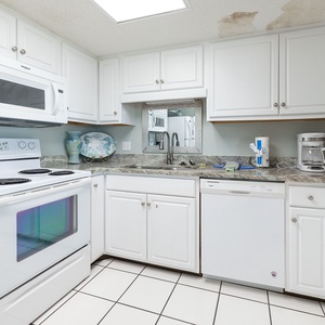 Craft tasty meals in this inviting kitchen, embracing the relaxed vibe of your beach escape