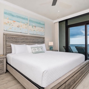 Enjoy peaceful nights in this inviting master bedroom with a king bed and beachfront balcony access