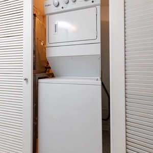 This laundry area features a convenient stacked washer and dryer, perfect for keeping your vacation clothes fresh