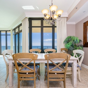 Gather around the spacious dining table, enjoying lively conversations and stunning views with loved ones