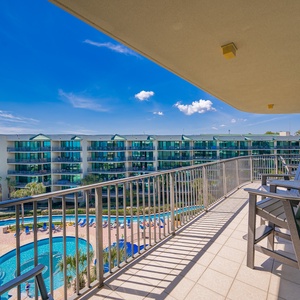 Soak in the vibrant atmosphere on your balcony, overlooking the inviting pool and lazy river area