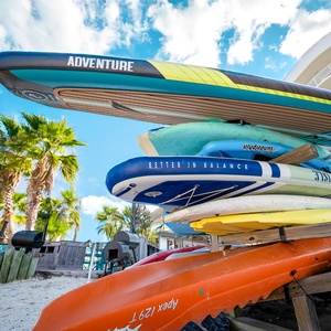 Explore the vibrant paddleboards and kayaks ready for your next adventure, and experience a new beach getaway at The Pass