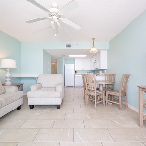 Enjoy in this inviting living area with a comfortable sofa, a cozy chair, and a dining space for shared meals