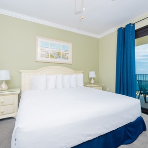 Brightly colored walls complement the king bed in the master, while sliding glass doors lead to the beach front balcony