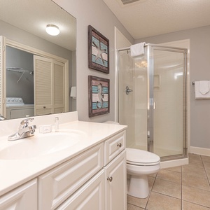 Refresh in this additional guest bath with a walk-in shower and laundry area with a washer and dryer in your rental