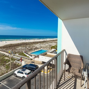 Unwind in your balcony chairs, soaking in the coastal vibe while taking in stunning views of the beach and poolside