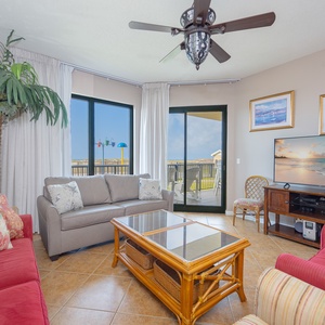 Inviting living area, featuring comfortable seating and a large TV for entertainment and leisure