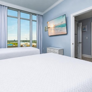 Unwind with views of the surrounding area and a good movie in this queen guest suite