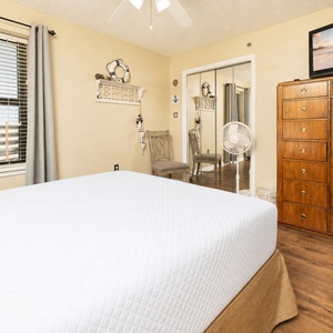 A guest suite with a queen bed welcomes you to unwind while watching a favorite show on the TV