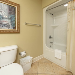 Freshen up in this guest bath in the relaxing shower or soothing tub before an exciting beach day