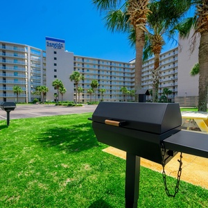 Relax by the beach with picnic tables and grills, perfect for outdoor gatherings and enjoying the beautiful surroundings