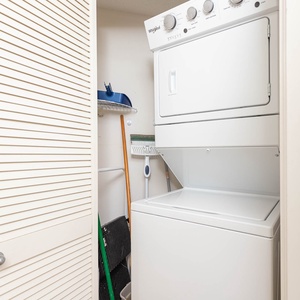 Washer and dryer combo tucked neatly in a closet, providing convenience for guests during their stay