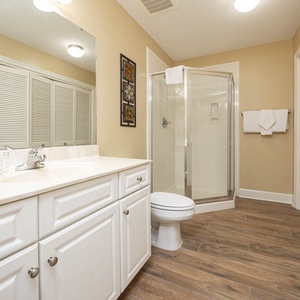 Refresh in this additional guest bath with a walk-in shower and laundry area with a washer and dryer in your rental