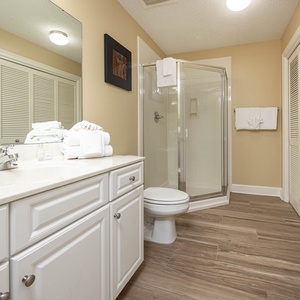 Refresh in this additional guest bath with a walk-in shower and laundry area with a washer and dryer in your rental
