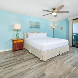 King bed in the master suite invites you to unwind after days filled with waves and coastal sunshine