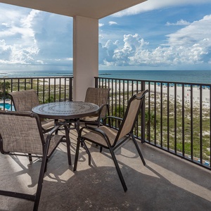 Enjoy meals or drinks at the outdoor table while taking in the beautiful coastal view from your balcony