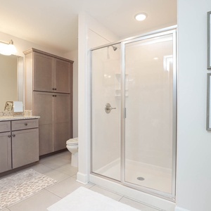 Rejuvenate in the spacious bathroom with a relaxing shower and elegant fixtures enhancing your everyday escape