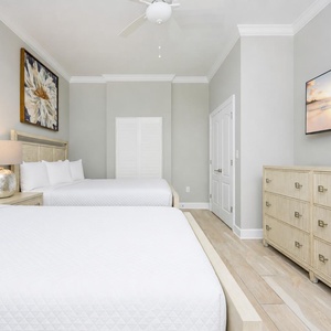 Stream your favorite shows after a beach day and relax in one of the queen beds in this guest suite