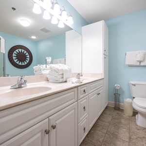 Master suite bath featuring a spacious vanity, ample towels, walk-in shower, and a relaxing jetted tub for your comfort
