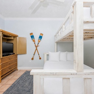 Curl up with loved ones on the cozy bunk bed, creating lasting memories after a day filled with fun